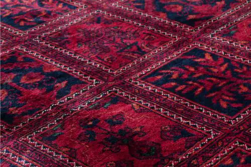 Photo of a patterned red carpet in excellent condition